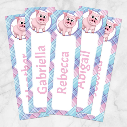 Printable Personalized Happy Pig Pink Blue and Purple Plaid Bookmarks at Printable Planning. Example of 5 bookmarks.