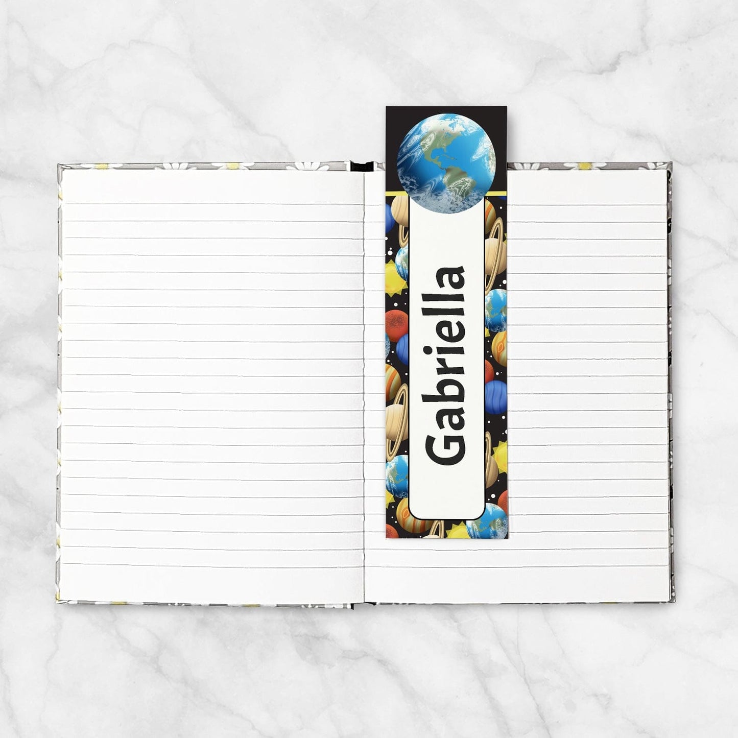 A Personalized Space Planets Pattern Bookmark in a blank 5x7 book as an example.
