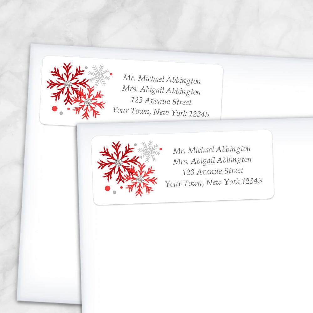Printable Winter Red Gray Snowflake Address Labels at Printable Planning. Shown on envelopes.