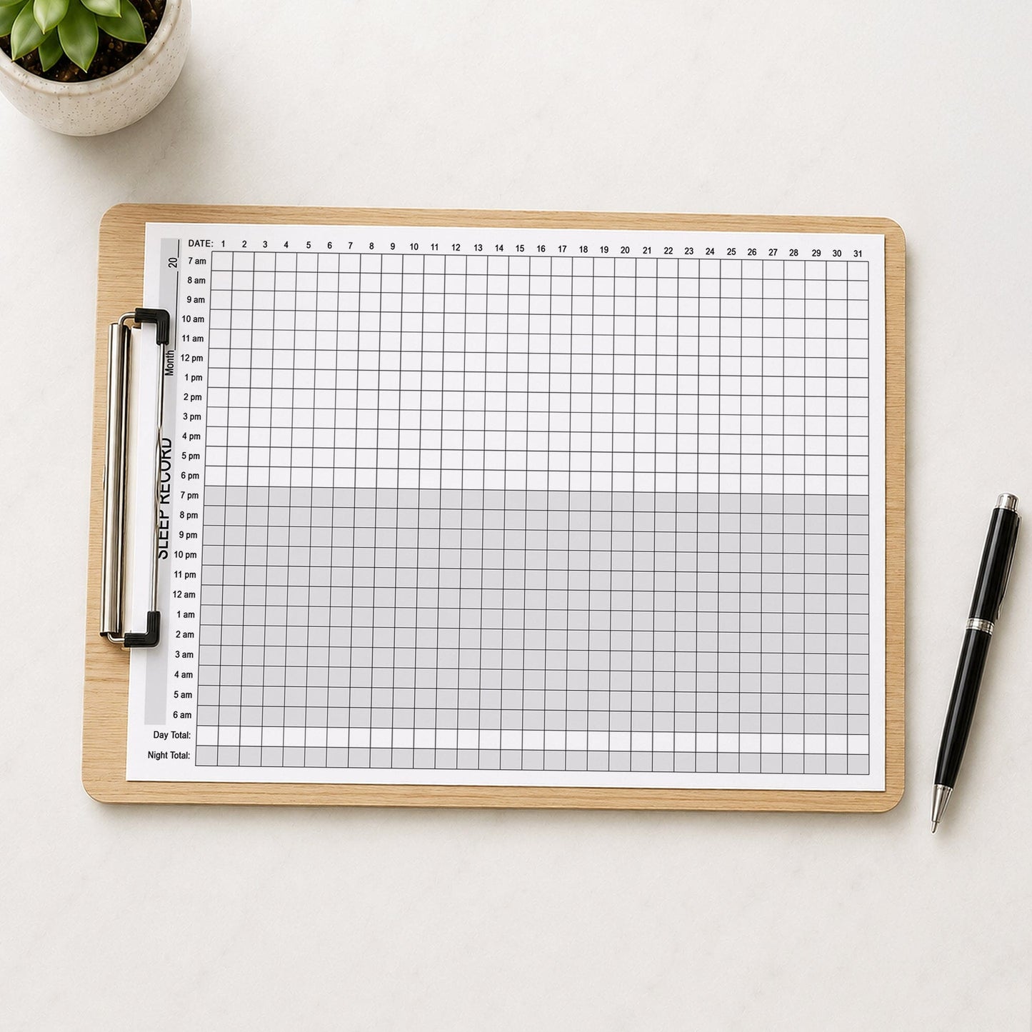 A wooden clipboard with a printed 24-Hour Monthly Sleep Tracker - Printable Sleep Record PDF page. The clipboard is photographed from above on a light table surface, with a small potted succulent in the top-left corner and a black pen in the bottom-right.
