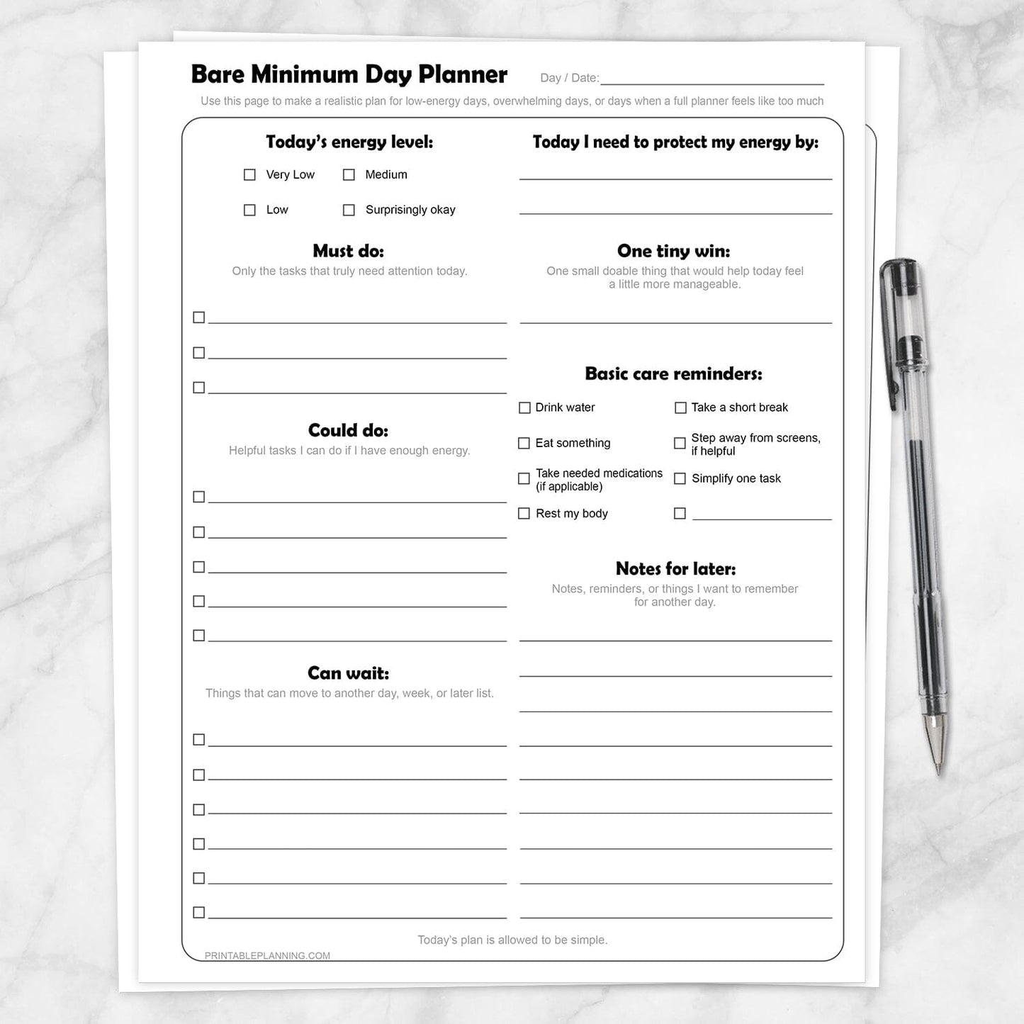 Bare Minimum Day Planner Printable shown on a marble surface with a pen.