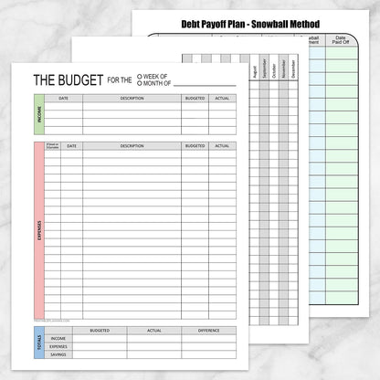 The three pages of the printable Financial Planning Bundle with Budget, Bill Tracker & Debt Payoff shown on a marble surface.