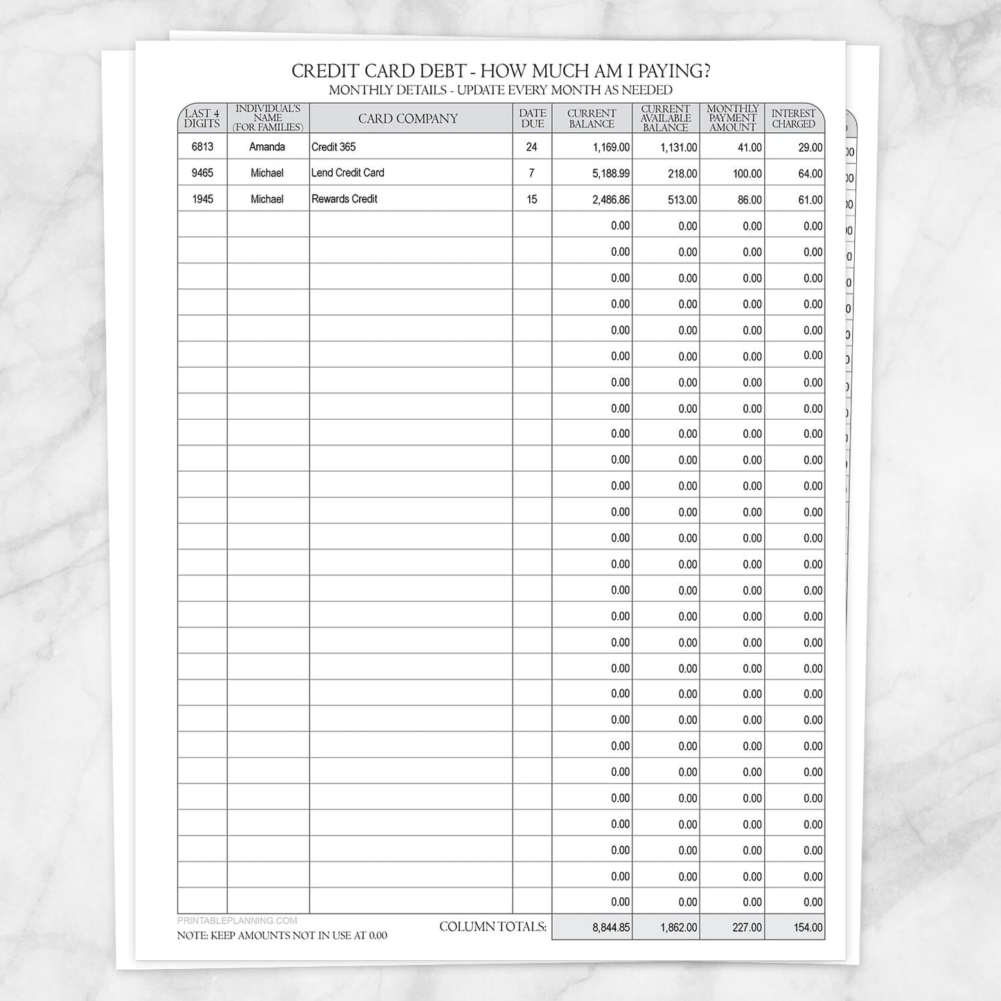 Printable Credit Card Debt Tracker with Auto-Calculating Totals shown on a marble surface.