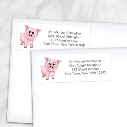 Printable Cute Happy Pink Pig Address Labels at Printable Planning. Shown on envelopes.