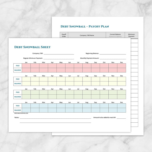The printable Debt Snowball Tracker & Debt Payoff Plan Bundle pages shown on a marble surface.