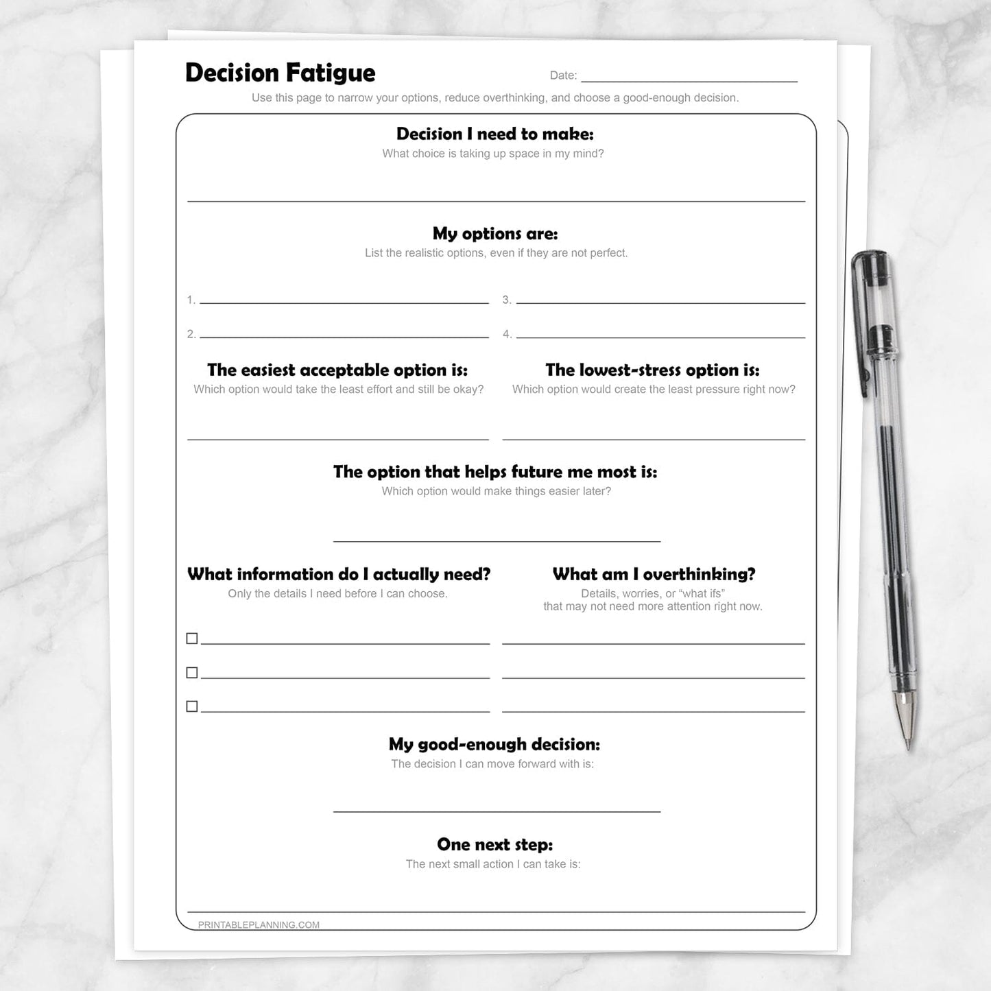 Decision Fatigue Printable Worksheet shown on a marble surface with a pen.
