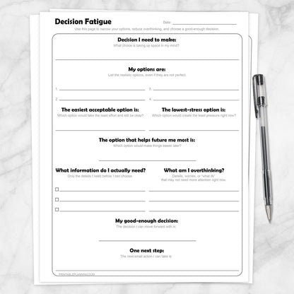 Decision Fatigue Printable Worksheet shown on a marble surface with a pen.
