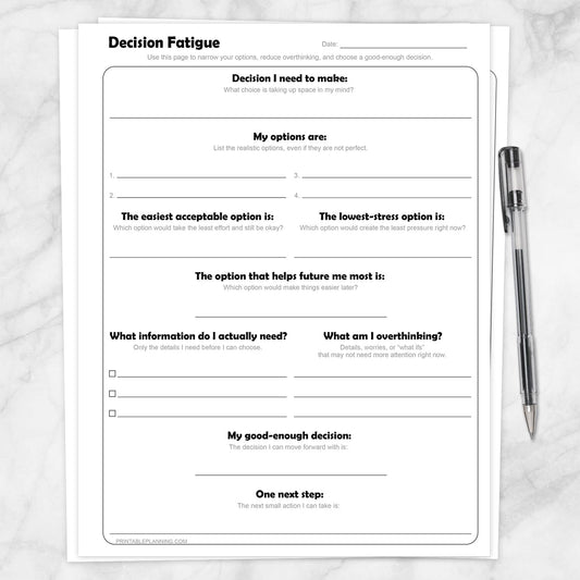Decision Fatigue Printable Worksheet shown on a marble surface with a pen.