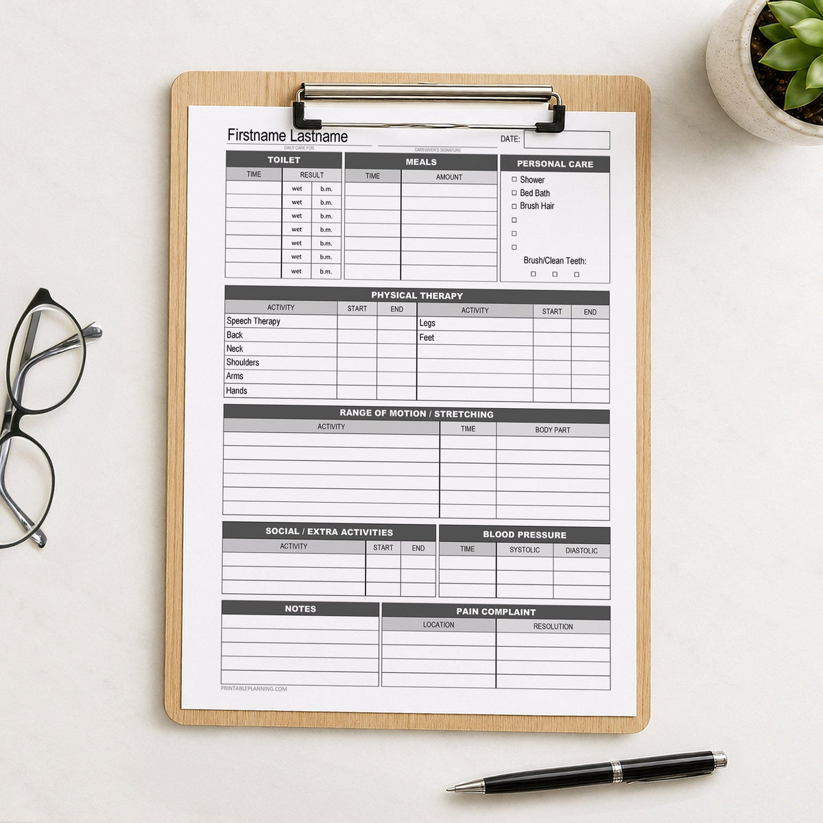 A printed Disability Caregiver Daily Log with Physical Therapy Tracker (printable page) shown on a wooden clipboard on a table with a plant, glasses, and a pen.
