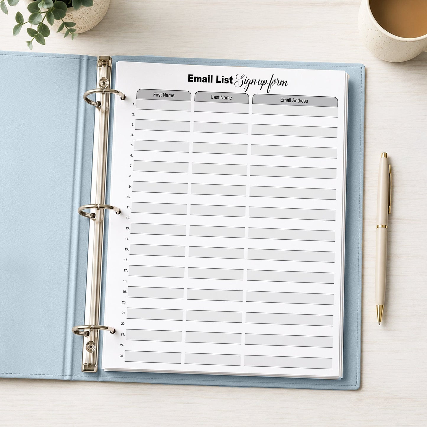 Email List Sign Up Form shown in a light blue binder on a desk with a plant, coffee, and a pen.
