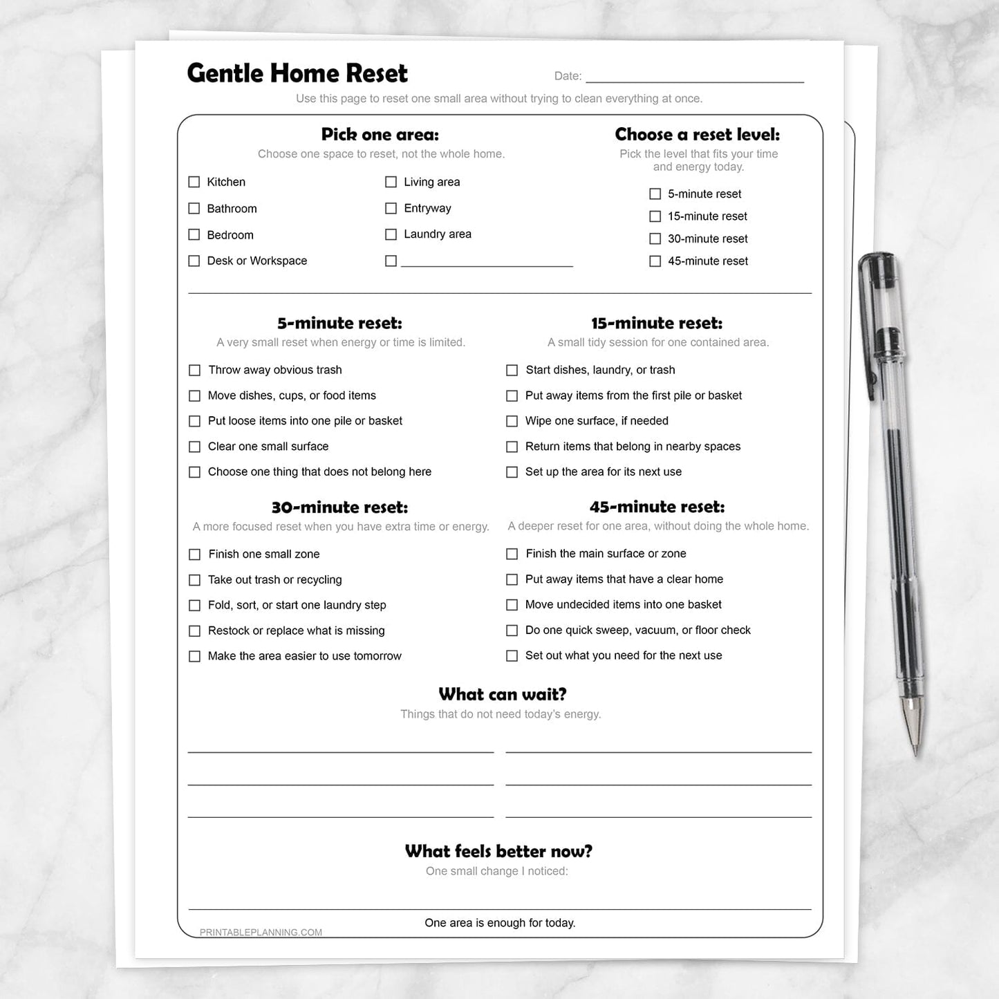Gentle Home Reset Printable Checklist on a marble surface with a pen.
