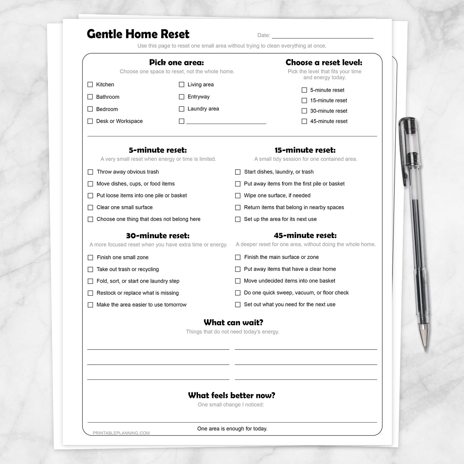 Gentle Home Reset Printable Checklist on a marble surface with a pen.