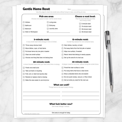 Gentle Home Reset Printable Checklist on a marble surface with a pen.