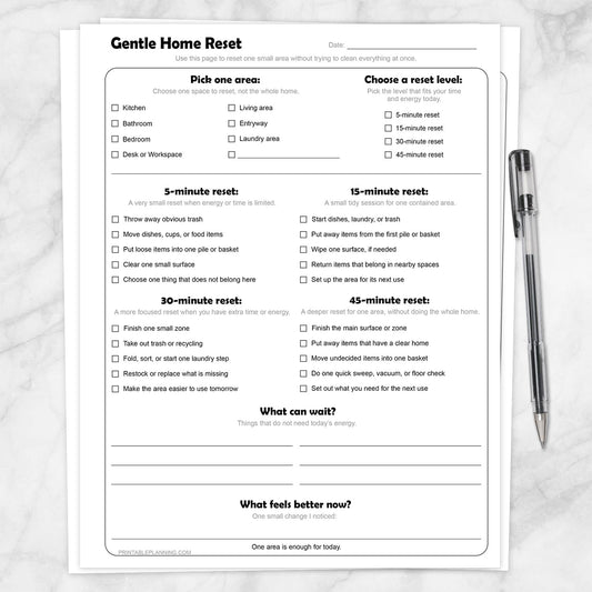 Gentle Home Reset Printable Checklist on a marble surface with a pen.