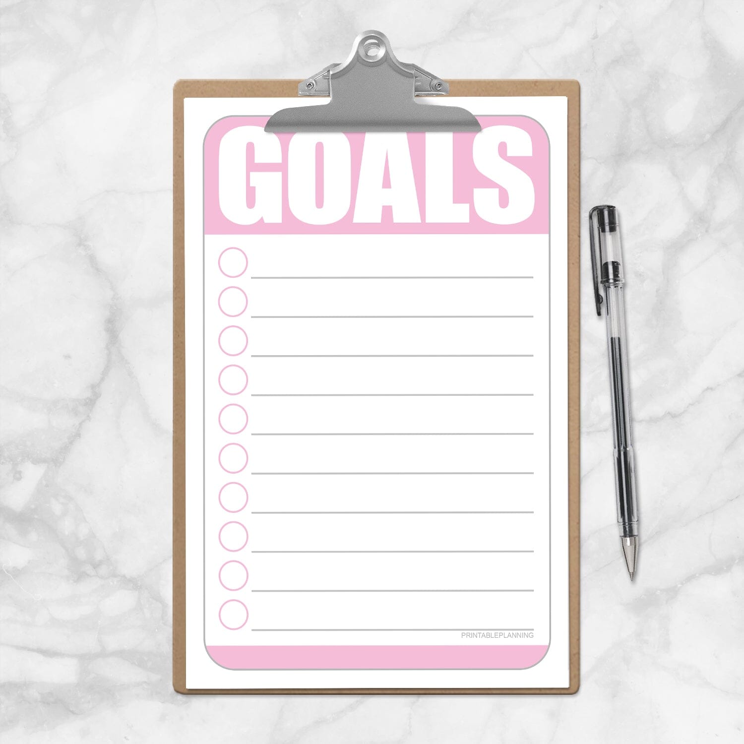 Printable Goals - Pink Half Page Checklist at Printable Planning. Photo shows the half size sheet on a mini clipboard.