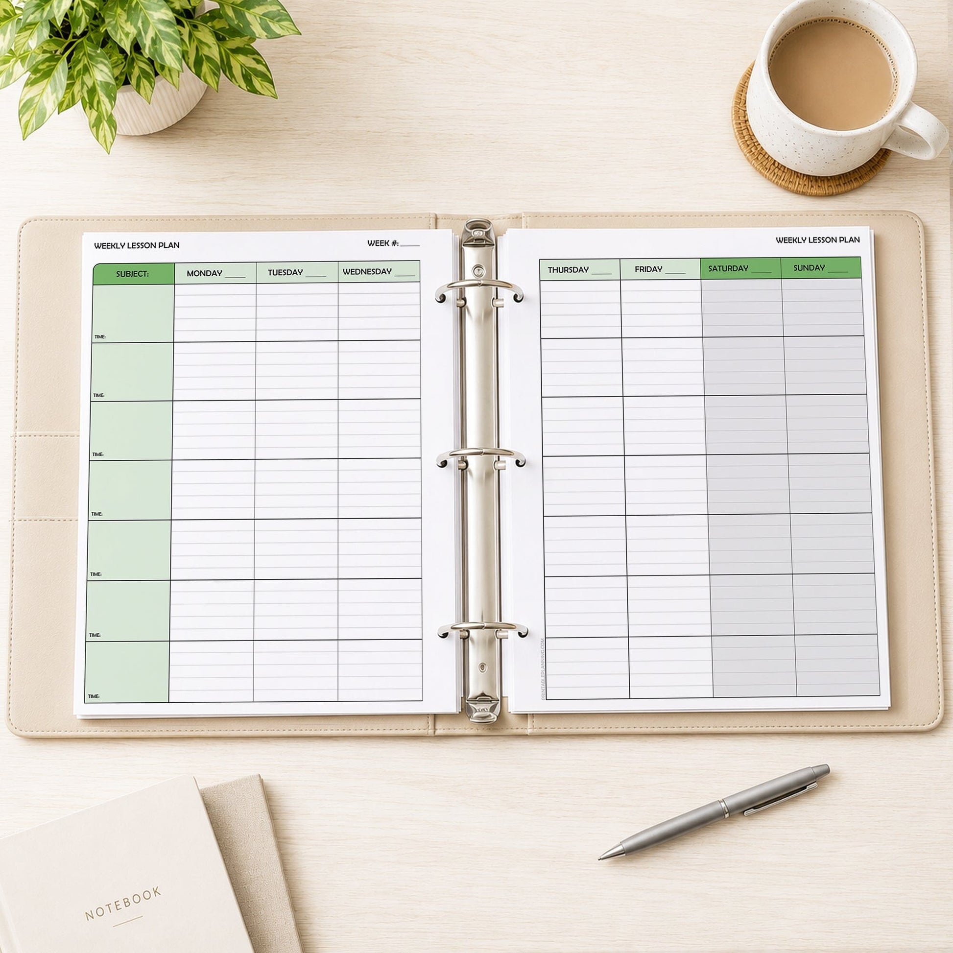 Two front and back printed Green Weekly Lesson Plan Pages for Teachers (printable) pages shown in a beige binder on a desk with a plant, coffee, notebooks, and a pen.