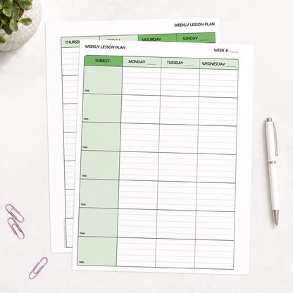 Two front and back printed Green Weekly Lesson Plan Pages for Teachers (printable) pages shown on a table with a plant, paperclips, and a pen.