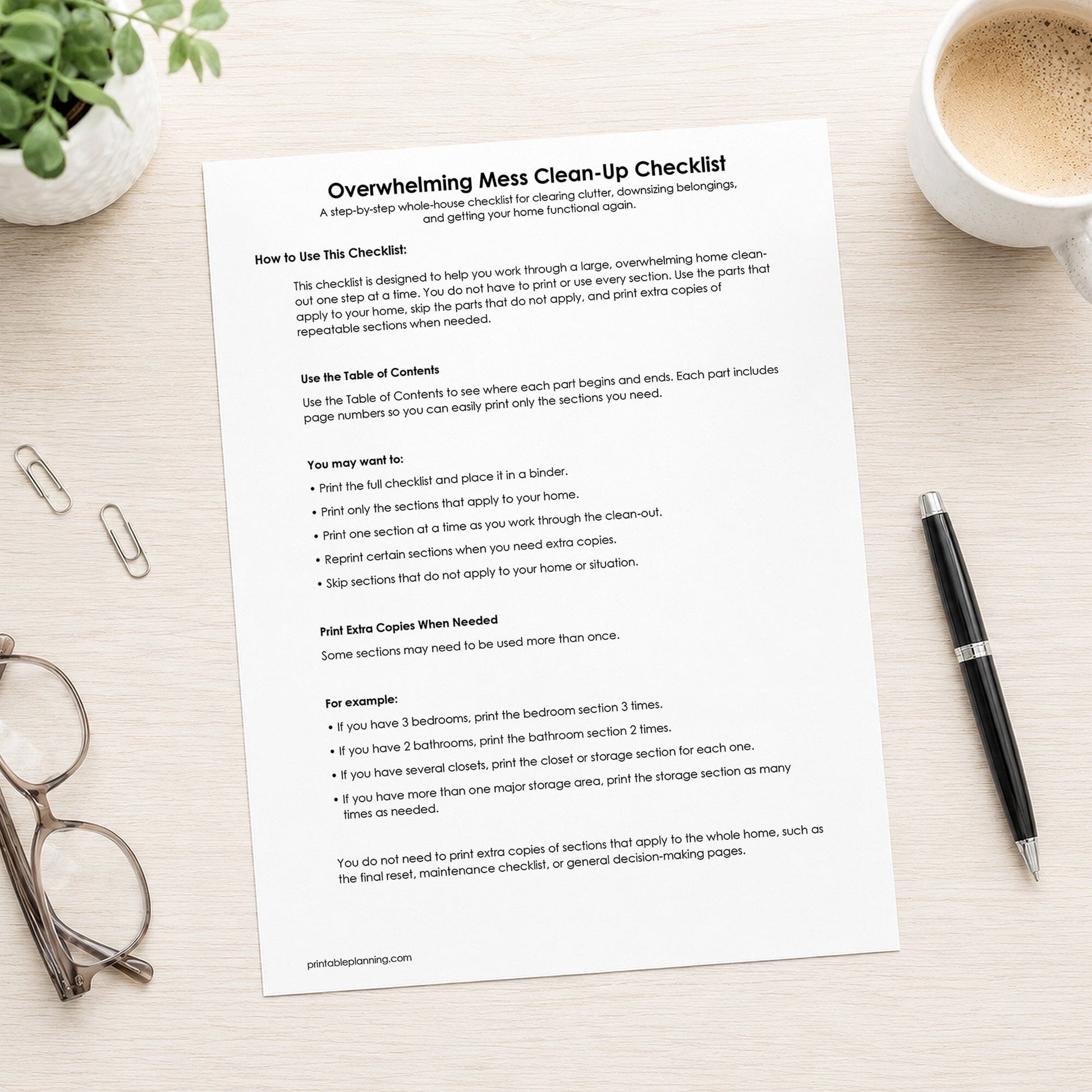 Printed first page of the printable How to Use This Checklist for the Overwhelming Mess Clean-Up Checklist, shown on a desk with a plant, glasses, coffee, paperclips, and a pen.
