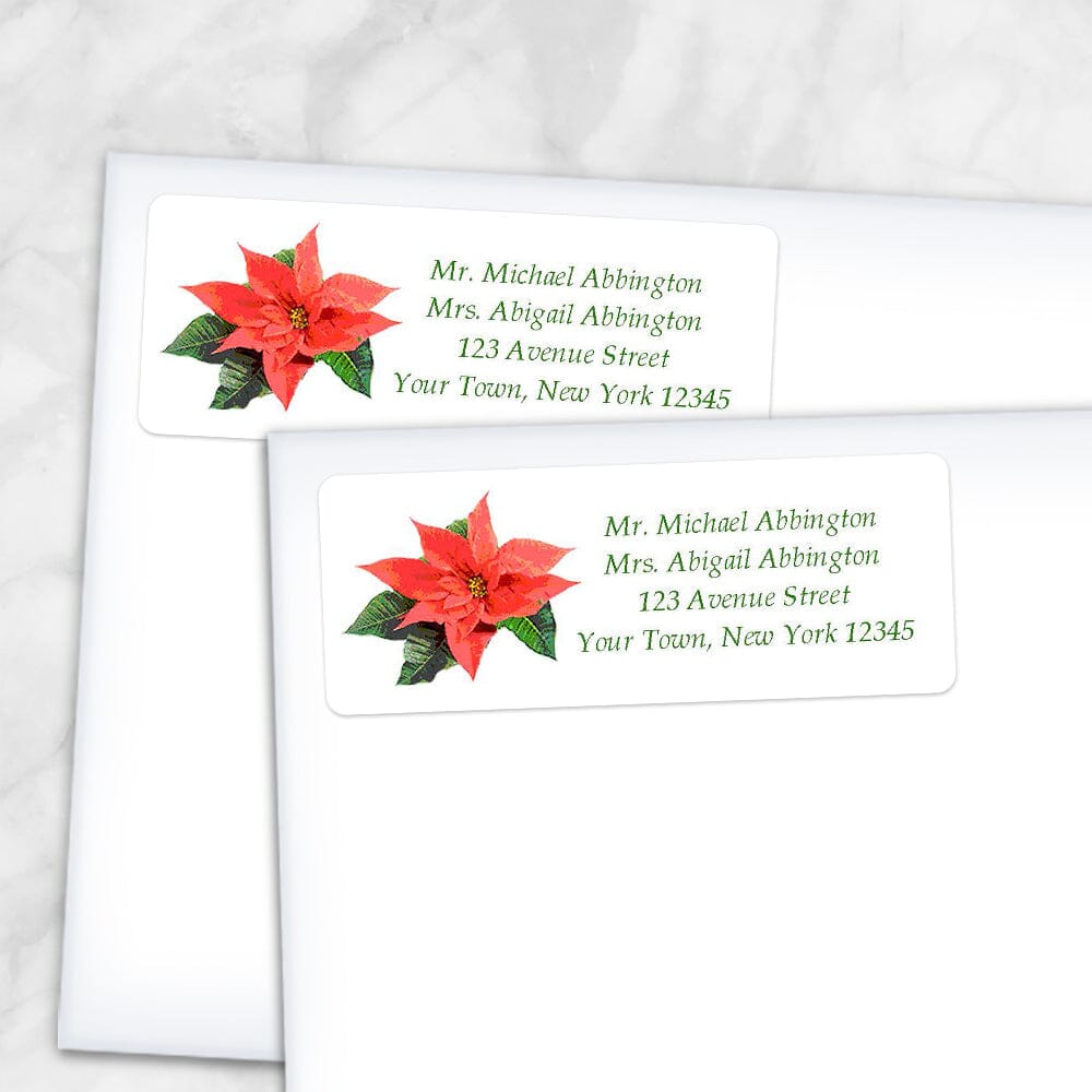 Printable Holiday Personalized Poinsettia Address Labels at Printable Planning. Shown on envelopes.