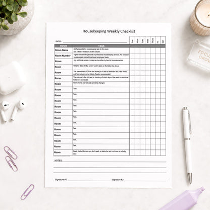 Housekeeping Weekly Checklist for Cleaning Services (printable page) shown on a light desk with earbuds, paperclips, highlighter, plant, and a pen.