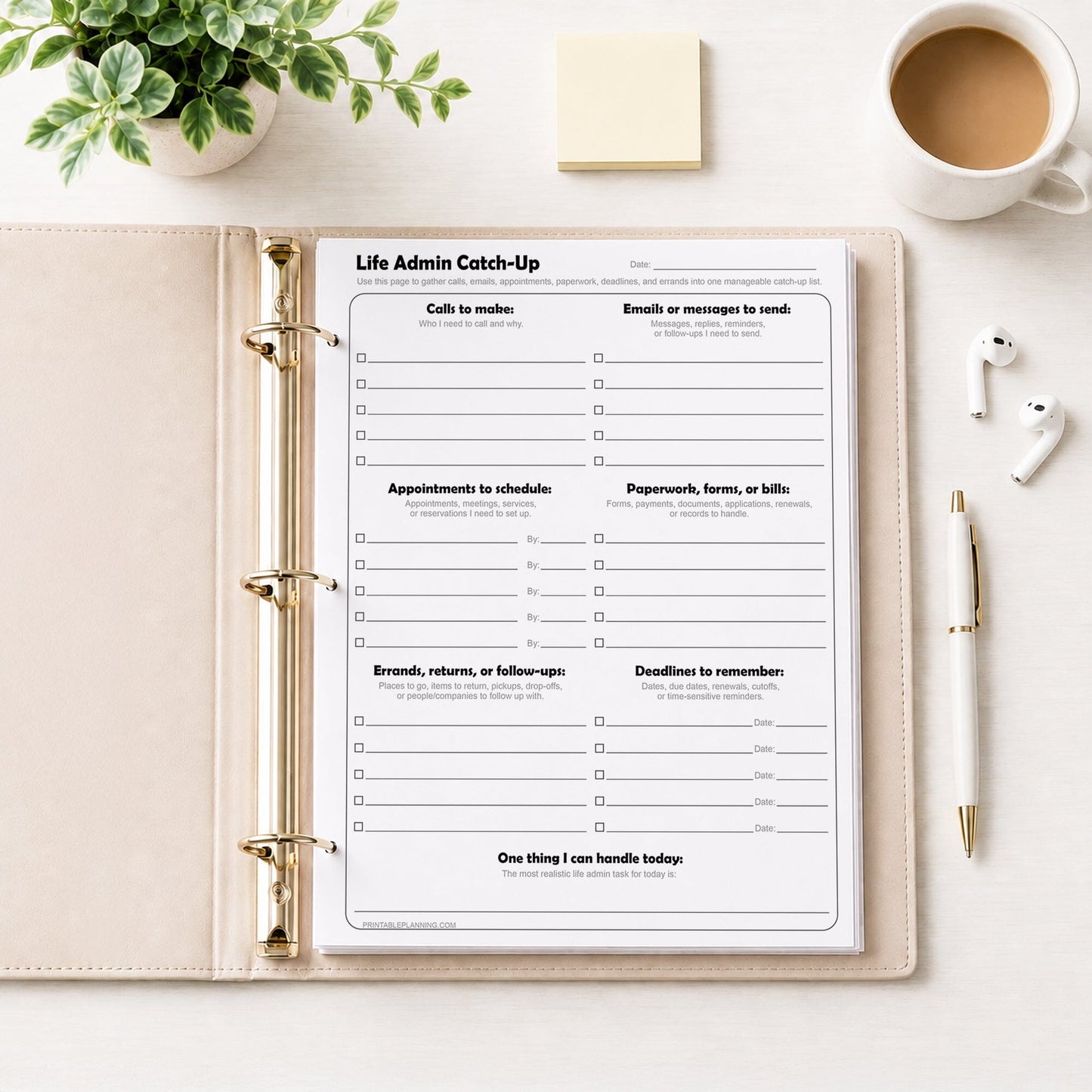 Life Admin Catch-Up Printable Planner Page shown in a binder on a desk with a plant, notes, coffee, earbuds, and a pen.