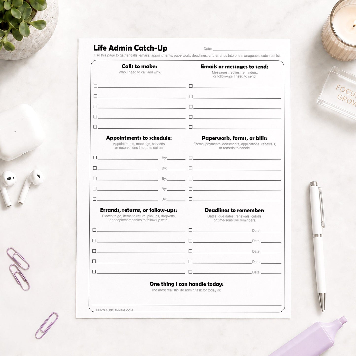 Life Admin Catch-Up Printable Planner Page on a light desk with a pen, highlighter, paperclips, and plant.