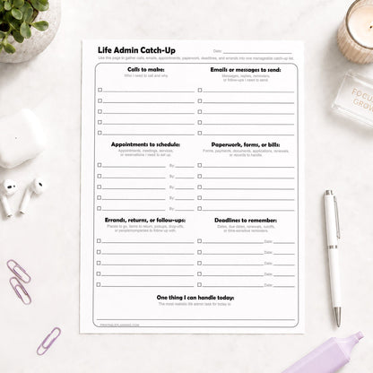 Life Admin Catch-Up Printable Planner Page on a light desk with a pen, highlighter, paperclips, and plant.