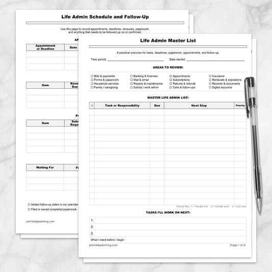 The printable Life Admin Master List and Follow-Up Tracker (2 Pages) shown on a marble surface with a pen.