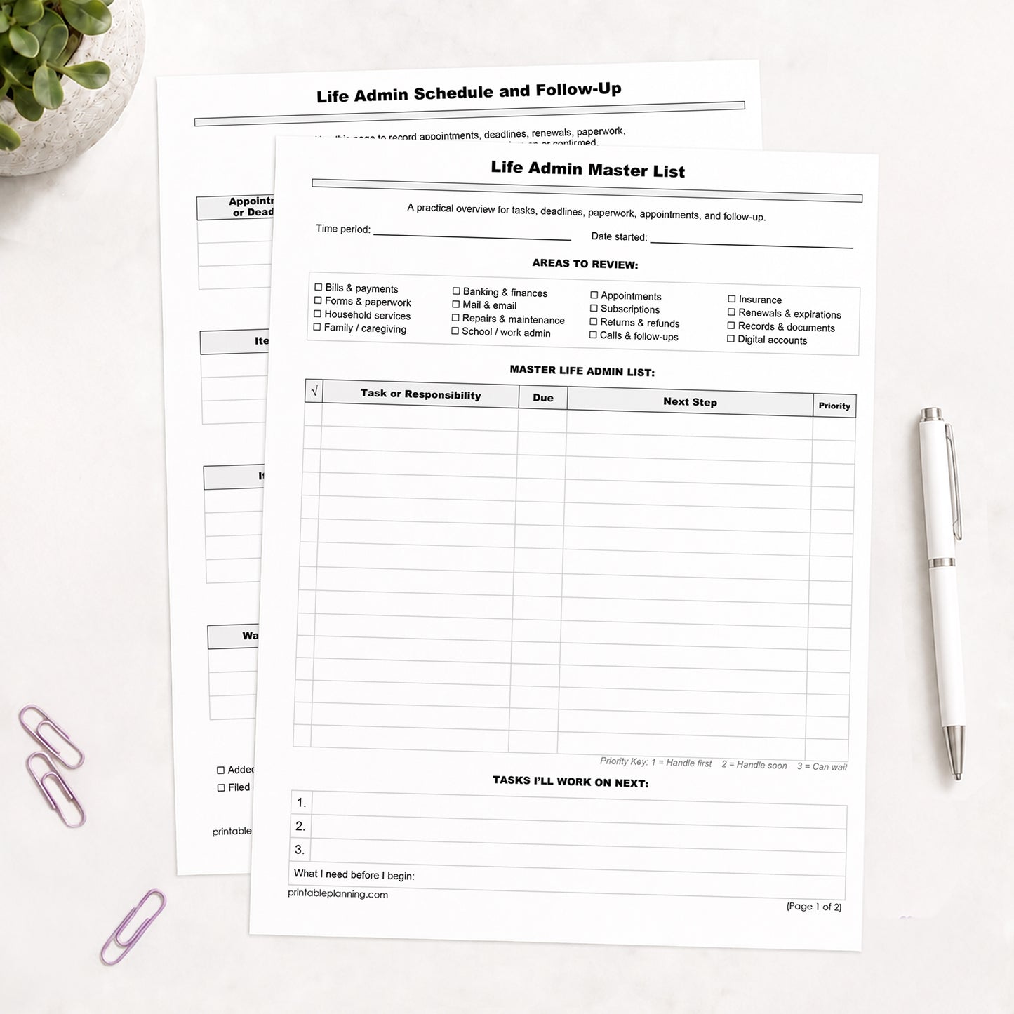 The printed Life Admin Master List and Follow-Up Tracker shown on a table with  plant, paperclips, and a white pen.