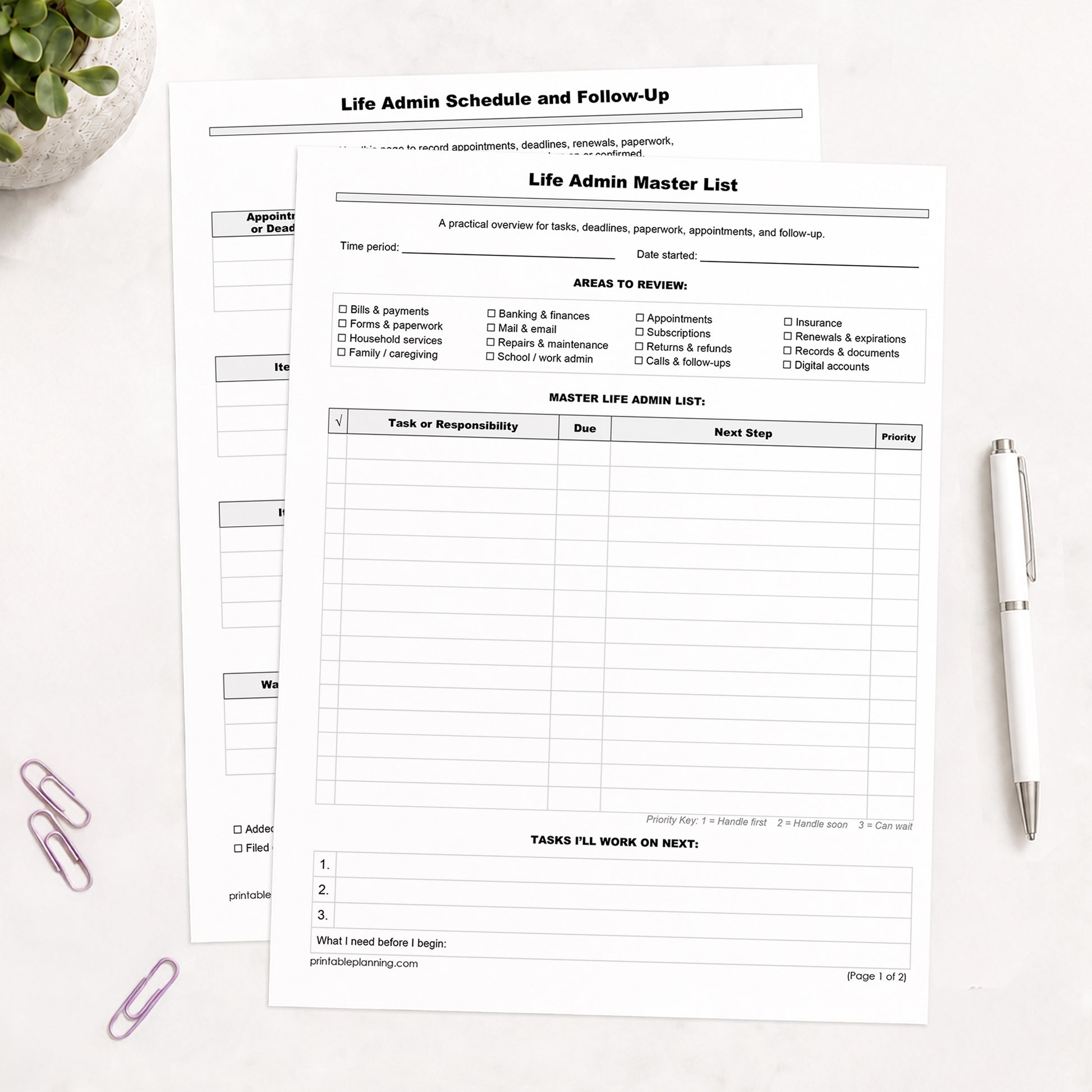 The printed Life Admin Master List and Follow-Up Tracker shown on a table with  plant, paperclips, and a white pen.
