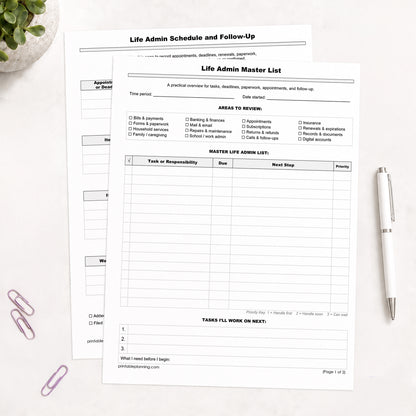 The printed Life Admin Master List and Follow-Up Tracker shown on a table with  plant, paperclips, and a white pen.