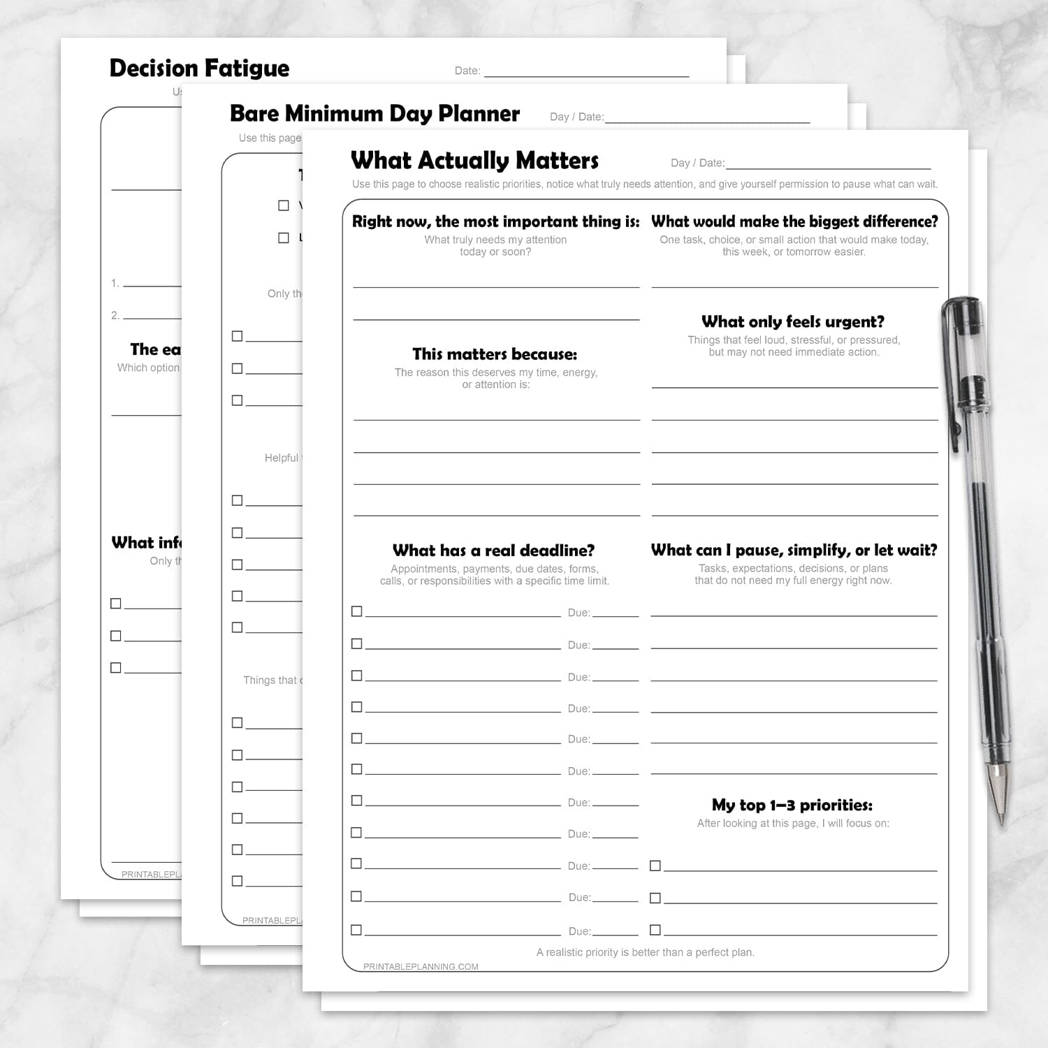 Low-Energy Day Planner Printable Bundle, including the What Actually Matters Priority Worksheet, Bare Minimum Day Planner - Printable Page,  and the Decision Fatigue Printable Worksheet, shown on a marble surface with a pen.