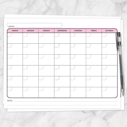 A printable Undated Monthly Calendar - Pink Full-Page Planner page shown on a marble surface with a pen.