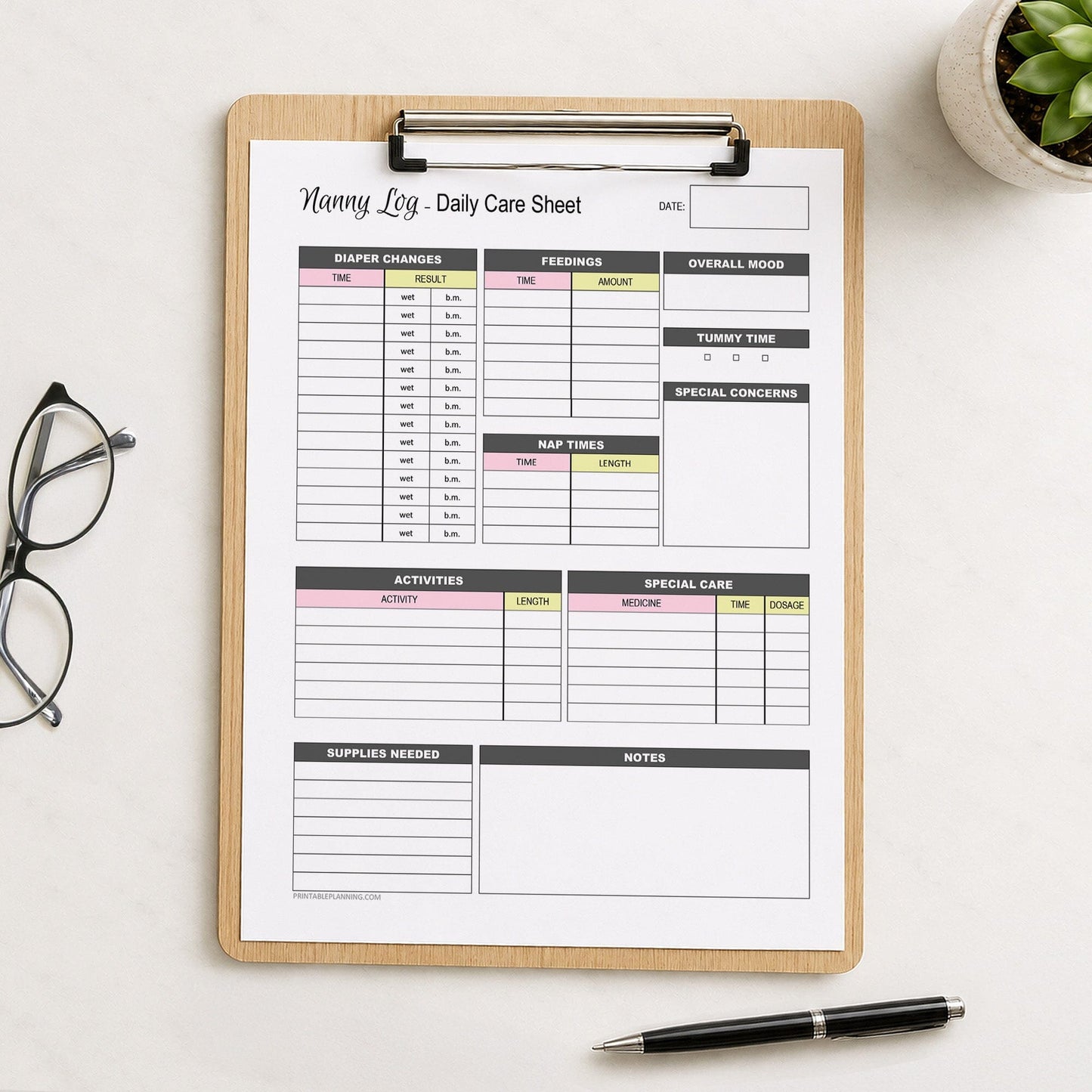 A printed Nanny Log Daily Infant Care Sheet - Pink and Yellow Printable PDF page shown on a wooden clipboard on a table with a plant, glasses, and a pen.