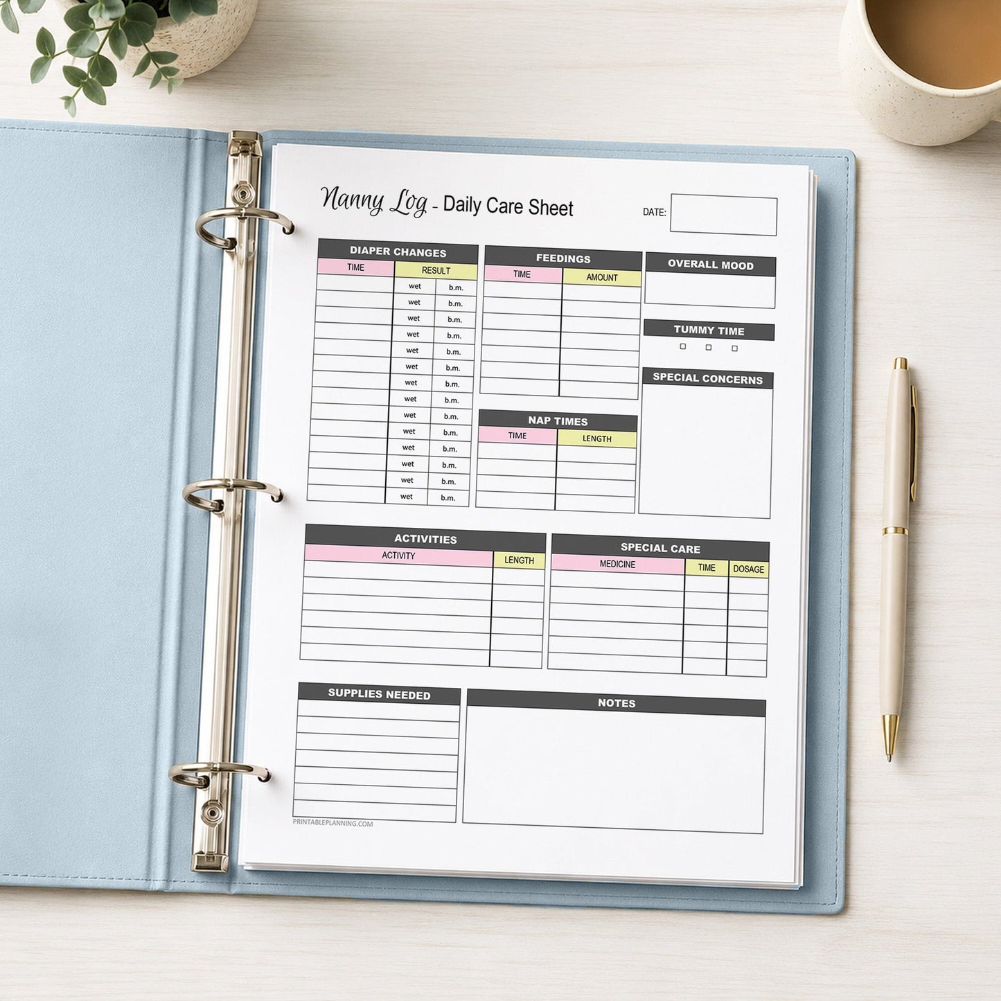 A printed Nanny Log Daily Infant Care Sheet - Pink and Yellow Printable PDF page shown in a light blue binder on a desk with a plant, coffee, and a pen.