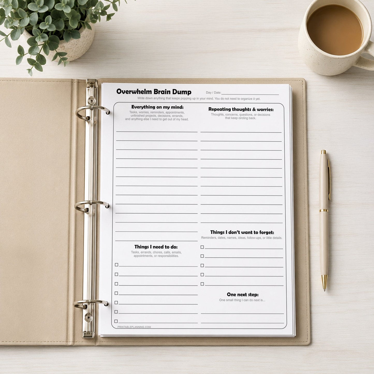 Overwhelm Brain Dump worksheet in a binder with a cup of coffee and pen on a desk.