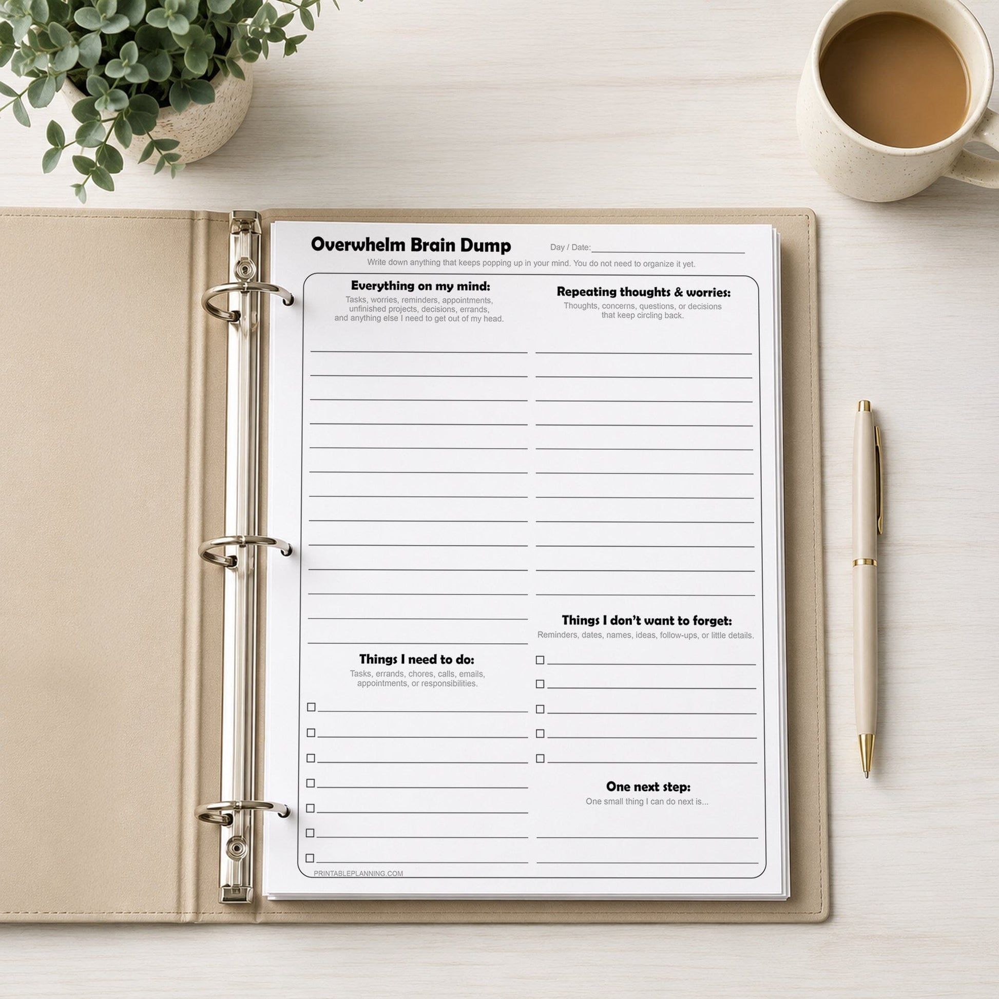 Overwhelm Brain Dump worksheet in a binder with a cup of coffee and pen on a desk.