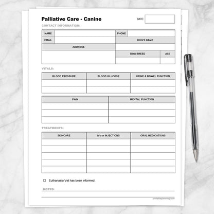A printable Dog Palliative Care Log and Treatment Record shown on a marble surface with a pen.