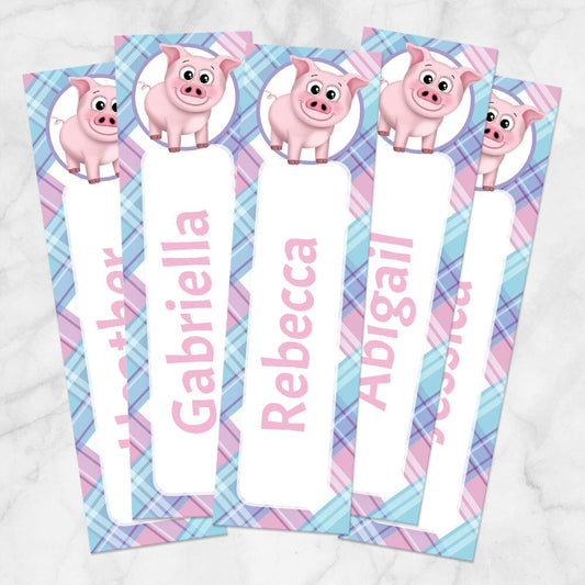 Printable Personalized Happy Pig Pink Blue and Purple Plaid Bookmarks at Printable Planning. Example of 5 bookmarks.
