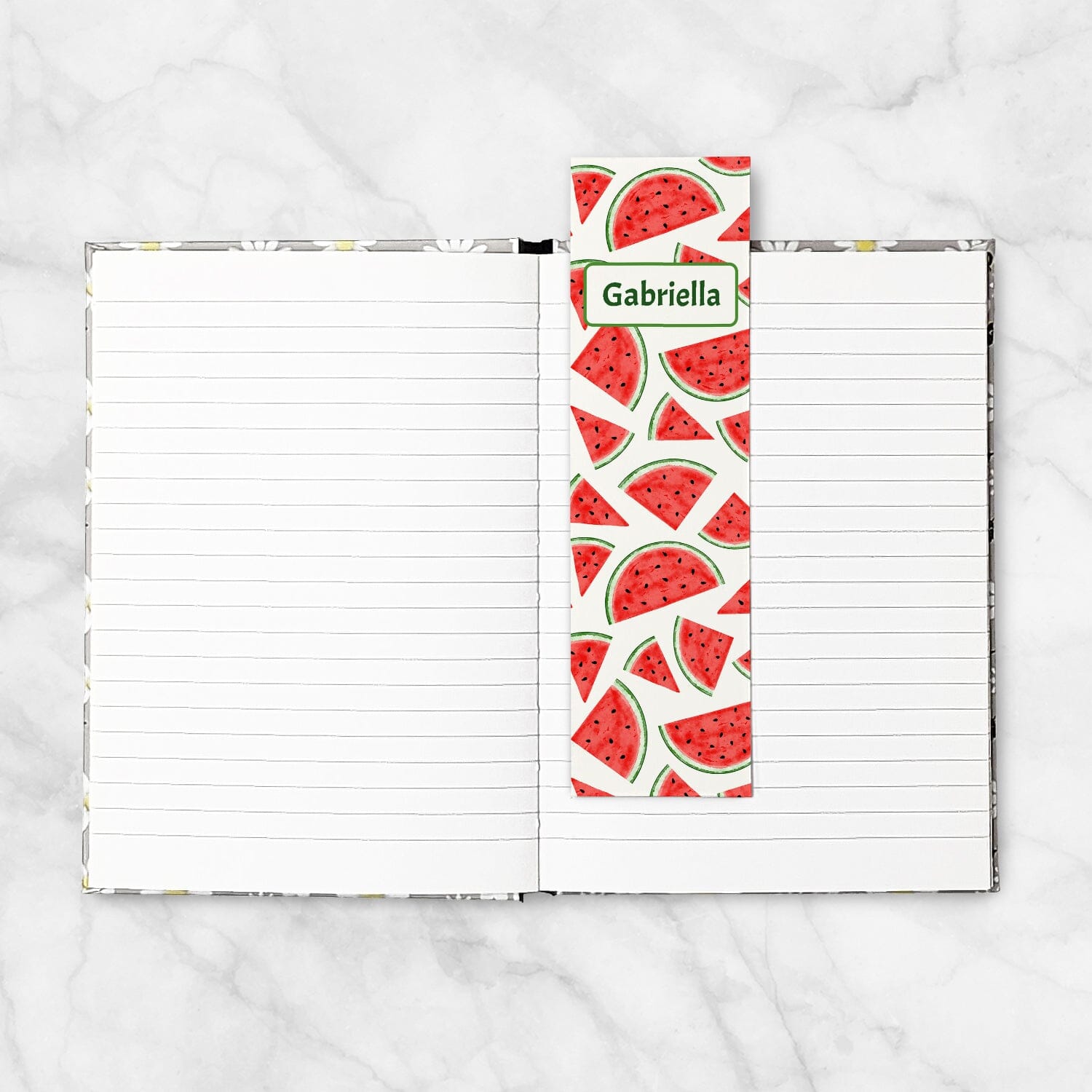 Printable Personalized Watermelon Slices Bookmarks at Printable Planning. Example bookmark in a hardcover notebook.