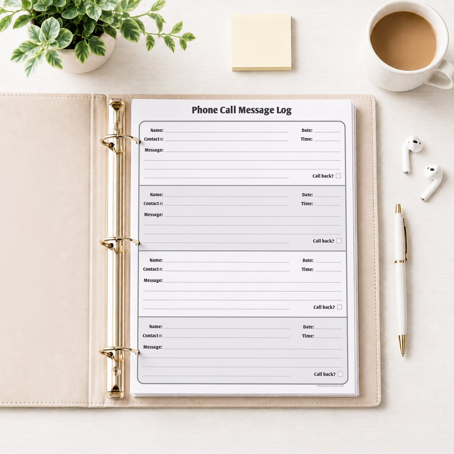 Phone Call Message Log shown in a beige binder on a desk with earbuds, coffee, notes, a plant, and a pen.
