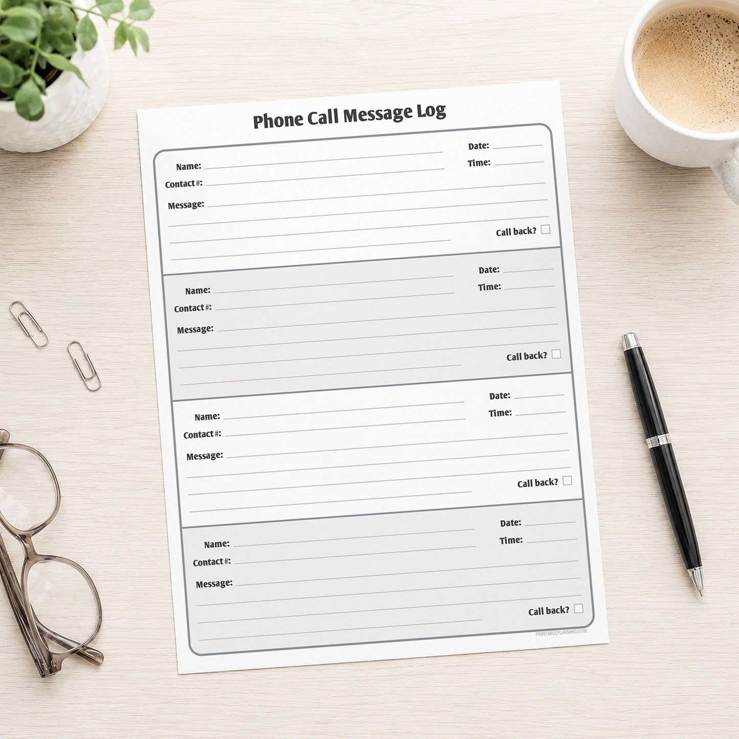 Phone Call Message Log shown on a desk with glasses, coffee, plant, and a pen.