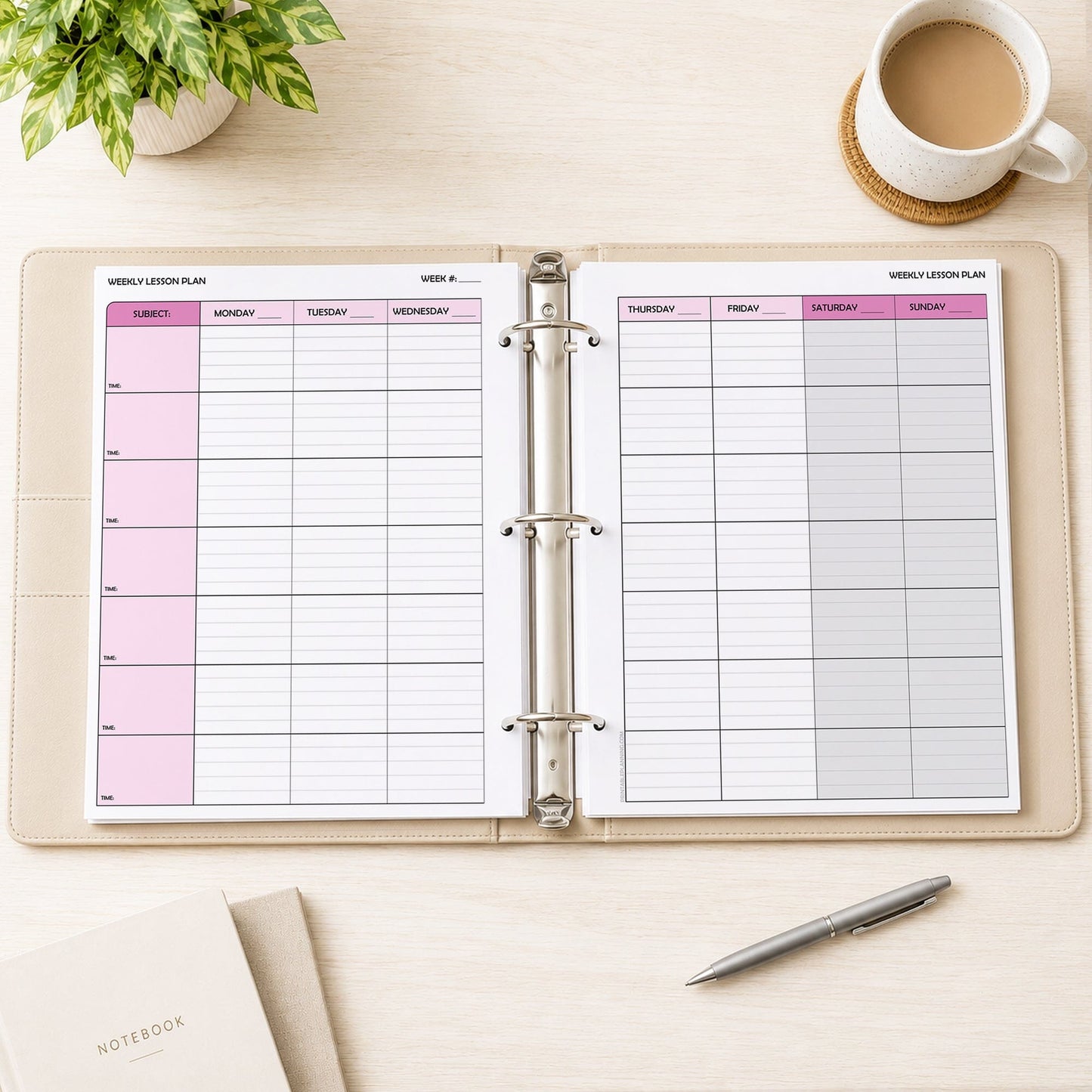 Two front and back printed Pink Weekly Lesson Plan Pages for Teachers (printable) pages shown in a beige binder on a desk with a plant, coffee, notebooks, and a pen.