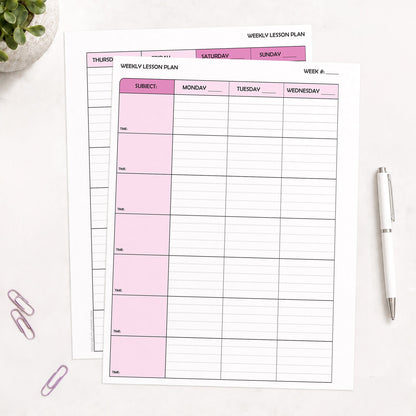 Two front and back printed Pink Weekly Lesson Plan Pages for Teachers (printable) pages shown on a table with a plant, paperclips, and a pen.