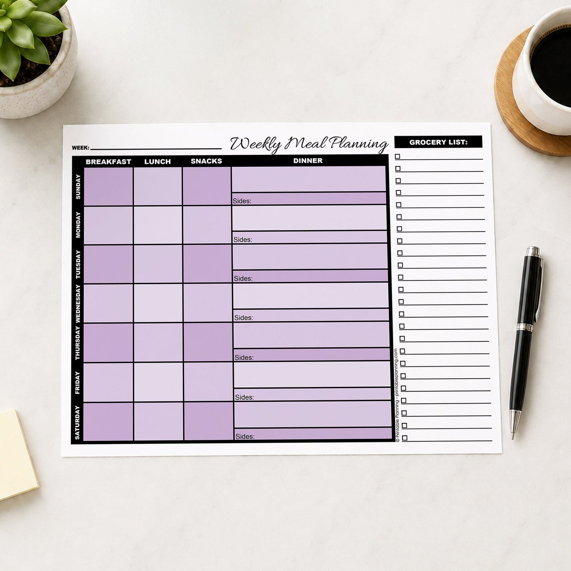 A printed Purple Weekly Meal Planner with Grocery List (printable page) shown on a table with a plant, sticky notes, coffee, and a pen.