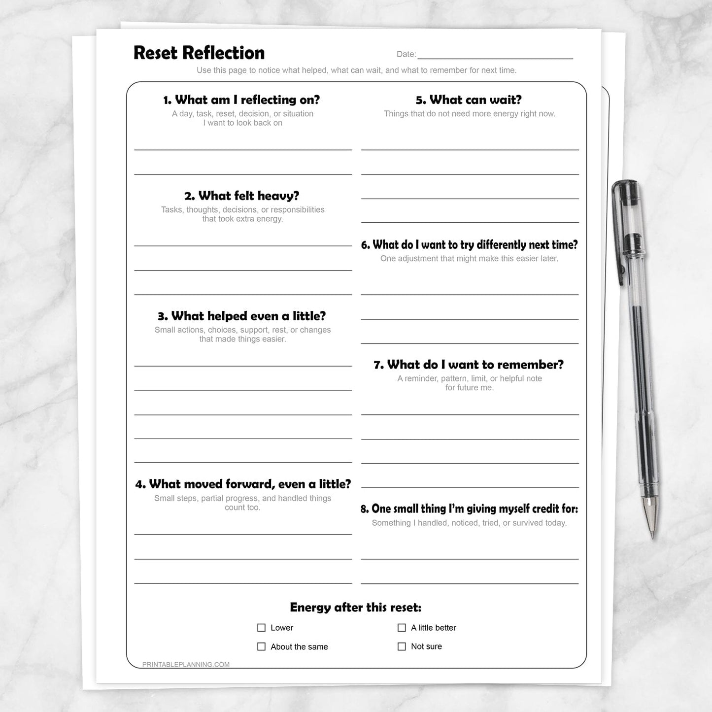 Reset Reflection Printable Worksheet shown on a marble surface with a pen.