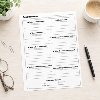 Reset Reflection Printable Worksheet shown on a desk with glasses, paperclips, coffee, plant, and a pen.