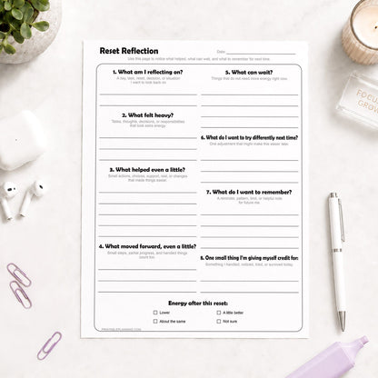 Reset Reflection Printable Worksheet shown on a light desk with earbuds, paperclips, a highlighter, plant, and a pen.