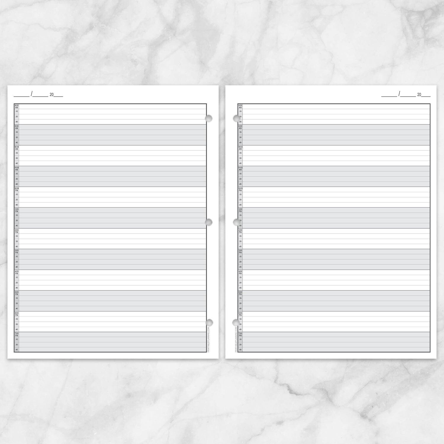 The printable front and back pages of the Full-Width Schedule Sheet in 15-Minute Increments shown as facing pages with 3 holes punched, on a marble surface.