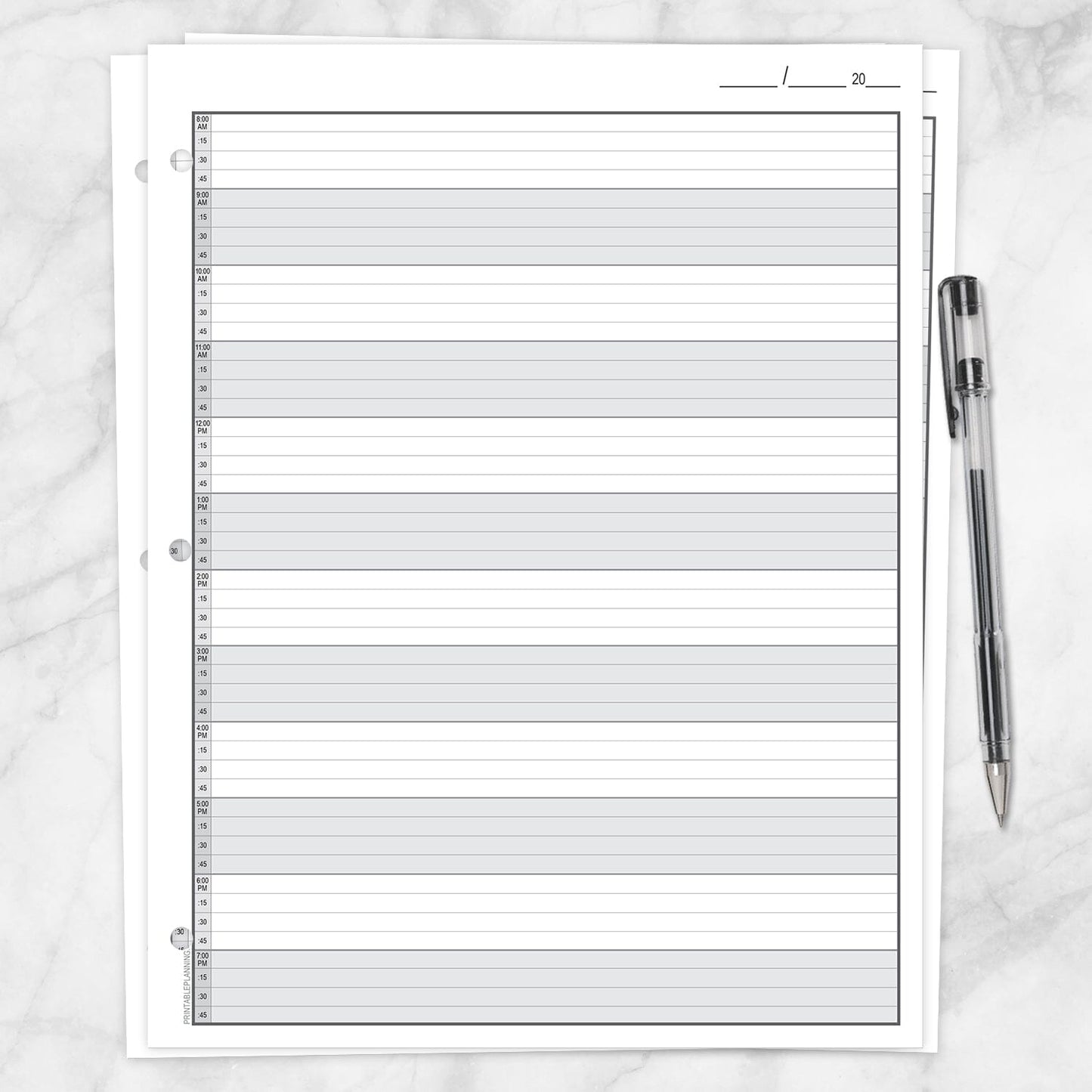 The printable front page of the Full-Width Schedule Sheet in 15-Minute Increments on a marble surface with a pen.